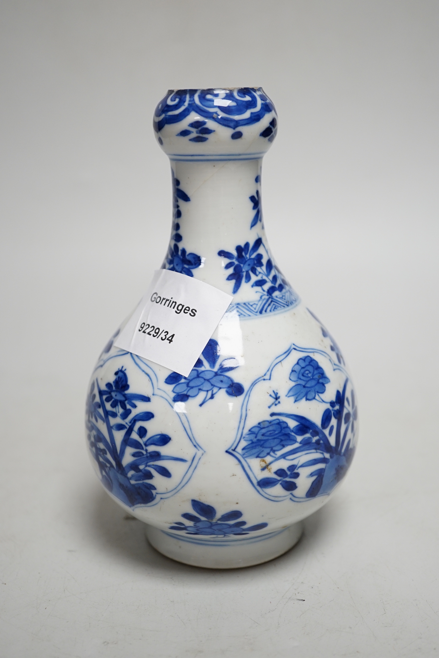 A Chinese blue and white garlic neck bottle, Kangxi period, 16cm, neck cut down